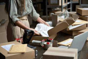 women packaging orders to send out